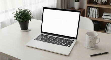 Fototapeta premium Laptop with a blank white screen on a bright desk in a modern office setting perfect for showcasing websites or applications in a professional and clean environment