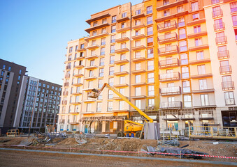 New Apartment Building Under Construction With Scaffolding. Complete construction of new apartment...
