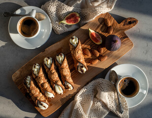 Italian Cannoli with Espresso, Fresh Figs, and Almonds on Olive Wood Board — Overhead Still Life