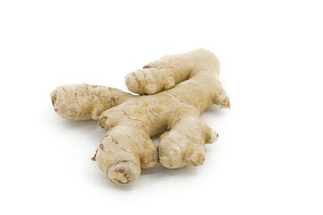 Ginger root on white, displaying its uneven organic form and textured skin surface.