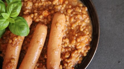 Lentils with sausage second course meal tasty appetizer fresh gourmet food background on the table rustic top view copy space