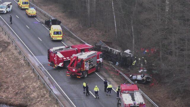 Police and firefighters working at the scene of a tragic accident in Latvia