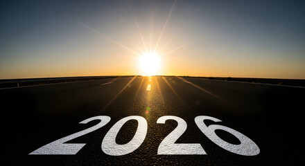 A bright future unfolds as the sun rises over a long road with the year 2026 painted on the pavement symbolizing the promise of new beginnings and forward momentum towards a new decade of