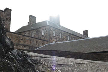 Inside Edinburgh Castle, ancient stone walkways and walls lead through medieval corridors and vaulted passages, showcasing battlements, archways, heritage of Scotland’s fortress architecture