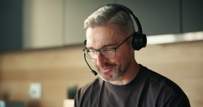 Tech support, consultant and man with headset, home and help with troubleshooting or communication. Happy, virtual assistant and mature person with mic for chat, problem solving and IT solution
