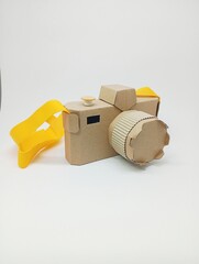 Cardboard camera at white background