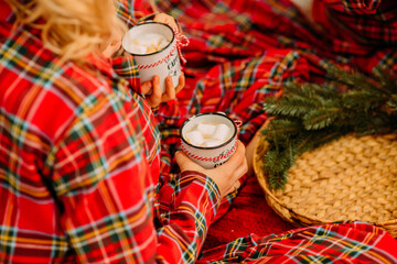 Cozy Christmas Setting with Hot Cocoa and Marshmallows on Festive Bed