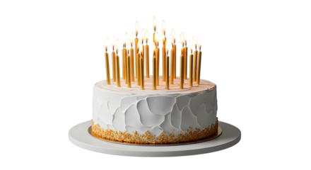White frosted cake with numerous lit gold birthday candles on a white cake stand isolated on a transparent background