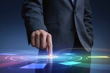 Businessman touching a glowing futuristic circular interface to activate a modern system