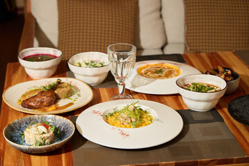 A Delicious Gourmet Meal is Beautifully Spread Out on a Rustic Wooden Dining Table