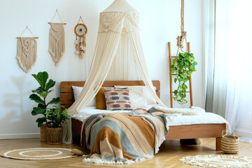 Boho bedroom with wooden bed, macrame canopy and wall hangings, layered textiles and indoor plants in soft light. Generative AI