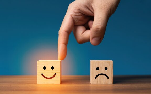 Choosing Happiness A Hand Selecting a Smiling Face