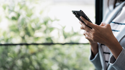 Woman use smart phone at workplace for online web internet search