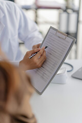 physician discusses health concerns with a patient in a medical consultation