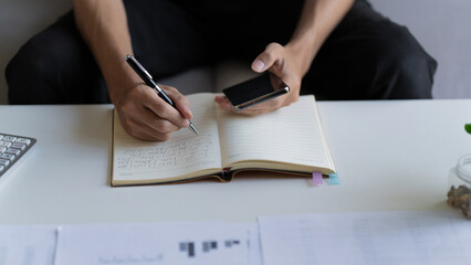 Businessman thoughtful using smartphone browsing internet