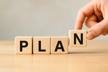 Naklejka premium Plan word on wooden blocks, hands of businessman putting letter N, business planning, strategic management, setting goals, success, vision, organization, new project, action