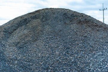 Construction material pile industrial site urban environment close-up texture focus
