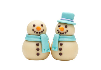 Isolated snowmen holiday figurines made of fondant for dessert decoration or festive party treats