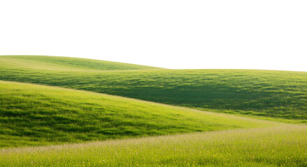 Obraz premium A scenic view of rolling green hills under a dark sky with sunlight illuminating the landscape