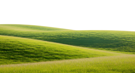A scenic view of rolling green hills under a dark sky with sunlight illuminating the landscape