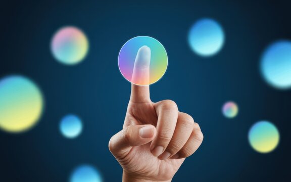 Human finger touching a glowing digital bubble, representing interaction with virtual reality and futuristic technology