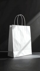 Stylish white paper shopping bag on a flat surface.