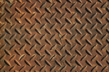 錆びた鉄板のテクスチャ。チェッカープレート（縞鋼板）のクローズアップ。錆び具合いのバリエーション