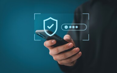 Obraz premium Person using a smartphone with a holographic display showing a security shield and password entry for online data protection and privacy