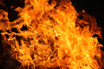 Blurred illustration of burning fire flame. Burning fire flame on black background.