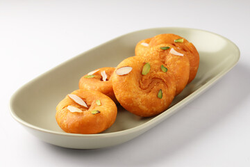 Balushahi, a traditional Indian dessert. This sweet is popular in North India, Odisha, and Bihar, and a similar pastry known as Badusha is found in South India. 
