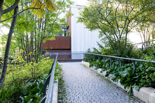 Urban garden sustainability greenery architecture housing Hjorthagen Stockholm Sweden calm atmosphere revealed in a wide-open courtyard celebrating future-oriented residential landscapes