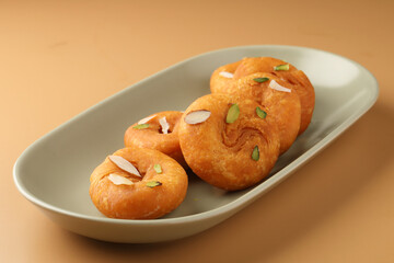 Balushahi, a traditional Indian dessert. This sweet is popular in North India, Odisha, and Bihar, and a similar pastry known as Badusha is found in South India. 
