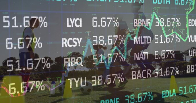 Practicing female players in kit running drills on grass with soccer ball, cones, market charts