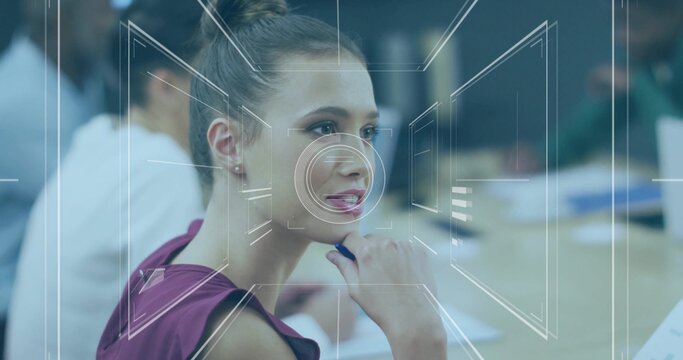Holding pen, woman in sleeveless maroon top studying notes at conference table with HUD overlay