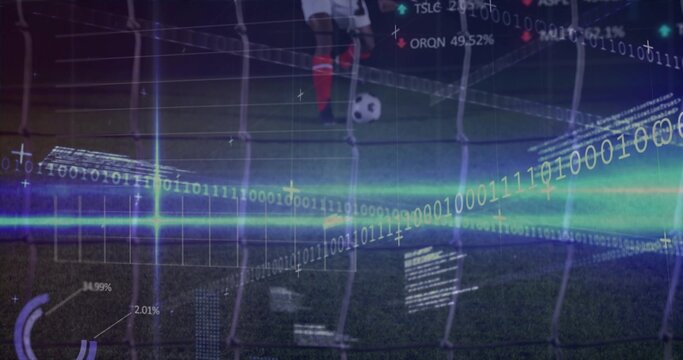 Standing soccer-player red-socked placing foot by ball on pitch at night, net and digital overlays