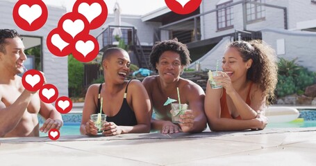 Leaning four friends in swimwear laughing and holding drinks at home pool, with heart overlays
