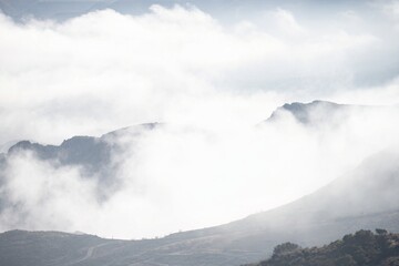Fog rolling over mountain peaks in Sierra de Guara landscape