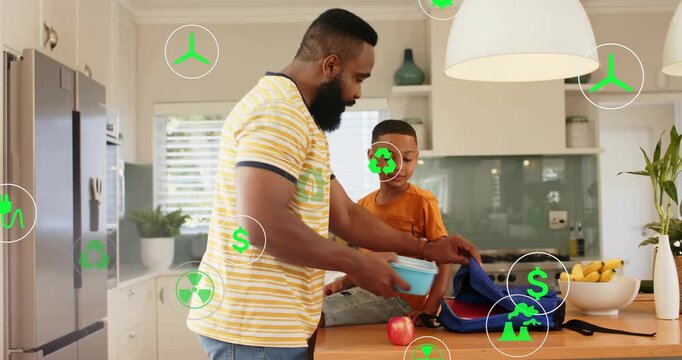 Morning father packing blue backpack placing red lunch son reaching eco icons overlaying school