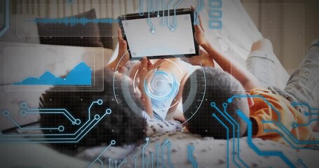 Siblings lying on bed with tablet, tapping lower edge for fun causing tech HUD reticle chart - Powered by Adobe