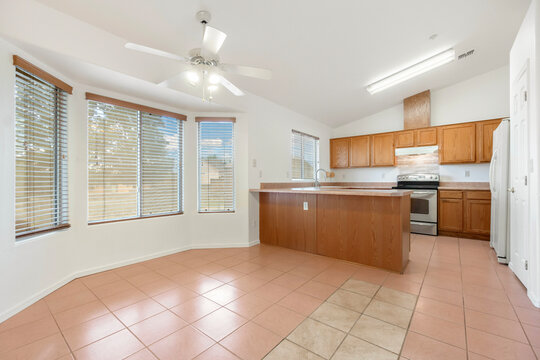 welllit kitchen with open breakfast area, bright spacious kitchen ideal for staging or renovation visuals