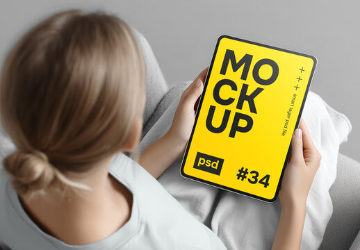 Tablet Mockup in Hands While Relaxing Indoors. Smart Layer Display