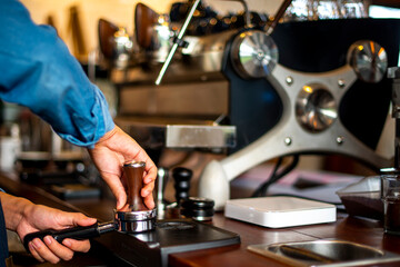 Barrista Tampering The Coffee Bean Grind To Get Espresso Shot
