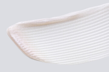 Cosmetic pink silver holographic shimmering lotion oil gel texture on neutral grey pastel background