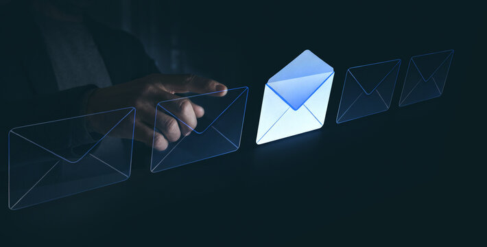 Hand Reaching to Select a Glowing Virtual Envelope, Highlighting the Concept of Choosing or Receiving Important Digital Mail - Powered by Adobe