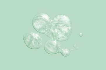 Cosmetic marine blue green shimmering oil gel texture background. Beauty product sample swatch