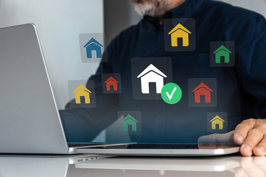 User selecting a home icon on a virtual screen for real estate or smart home management