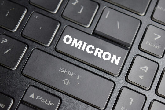 Omicron is the name given to a variant of the SARS-CoV-2 virus button on the keyboard - Powered by Adobe