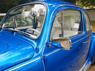 Blue metallic vintage car.Horizontal Photo.