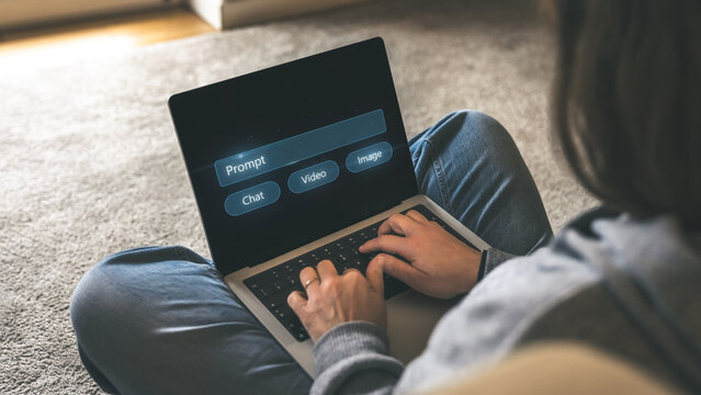 Remote User Typing on a Laptop, Interacting with a Generative AI System Prompting for Text, Video, Image, and Chat Input