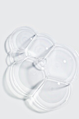 Cosmetic cleansing washing gray foam gel in water texture. Beauty product sample swatch